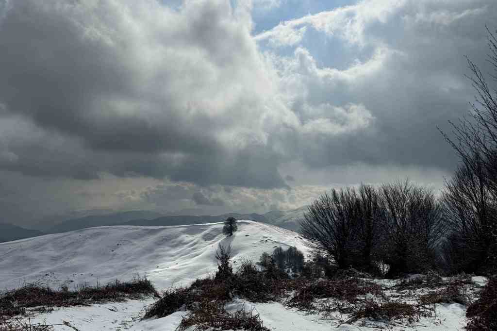 Snow-capped mountain view from a high altitude, symbolizing peaceful isolation
