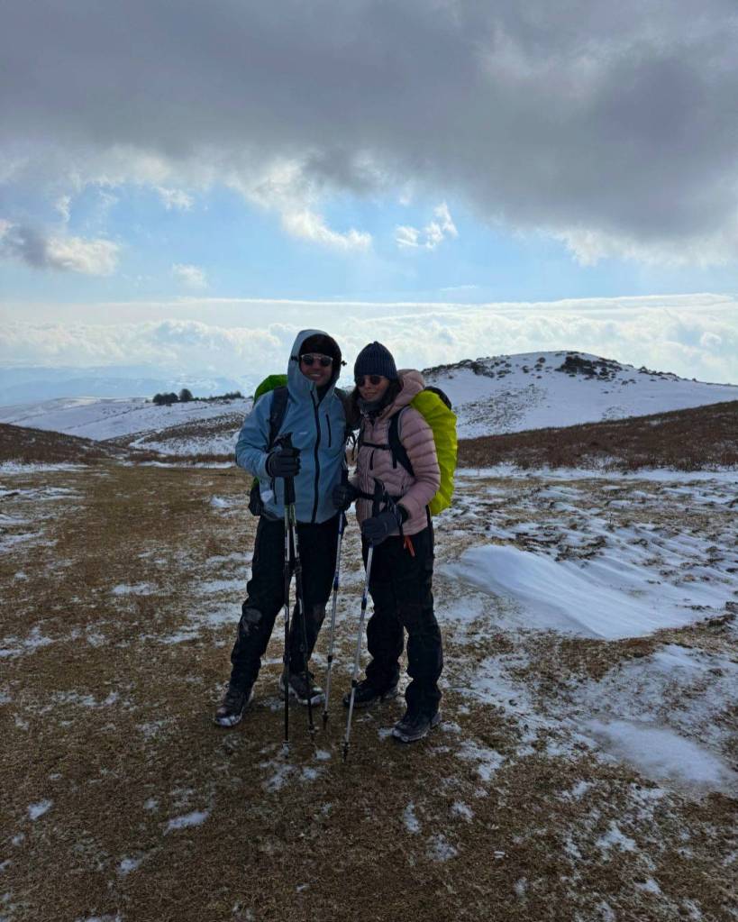 Standing on a snow-covered trail with a spectacular cloud sea in the distance